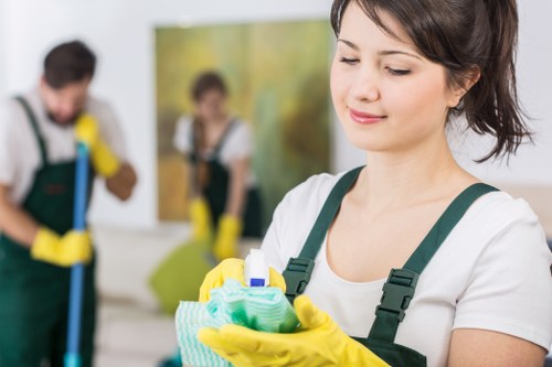 Professional carpet cleaner using protective gear on site