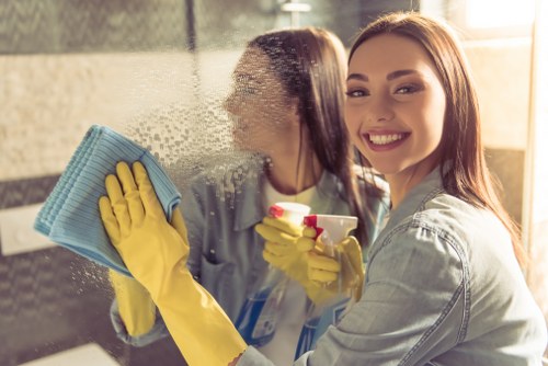 Technician performing mattress cleaning in a Canary Wharf apartment